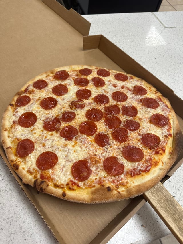 "Family Combo" Large 1 Topping Pizza, 6 Pieces Wings, 6 Garlic Knots & 2 Liter Soda.